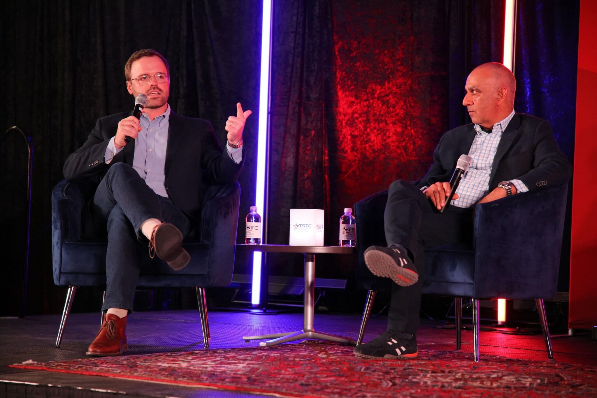 Chris Smith speaking on stage at a Texas State Technical College panel